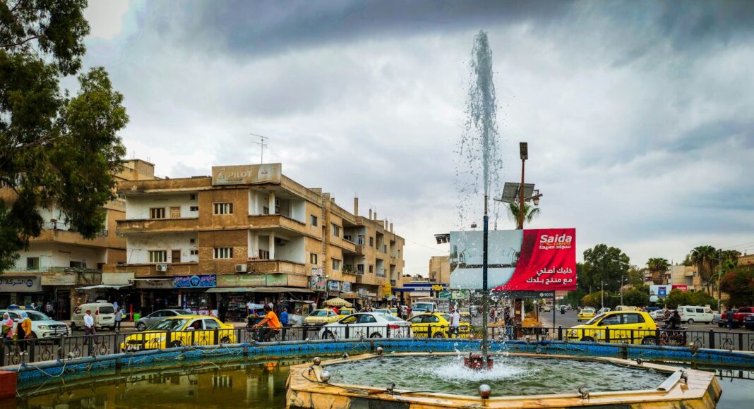 a fountain in the middle of a city square