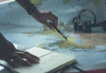 person writing on white paper