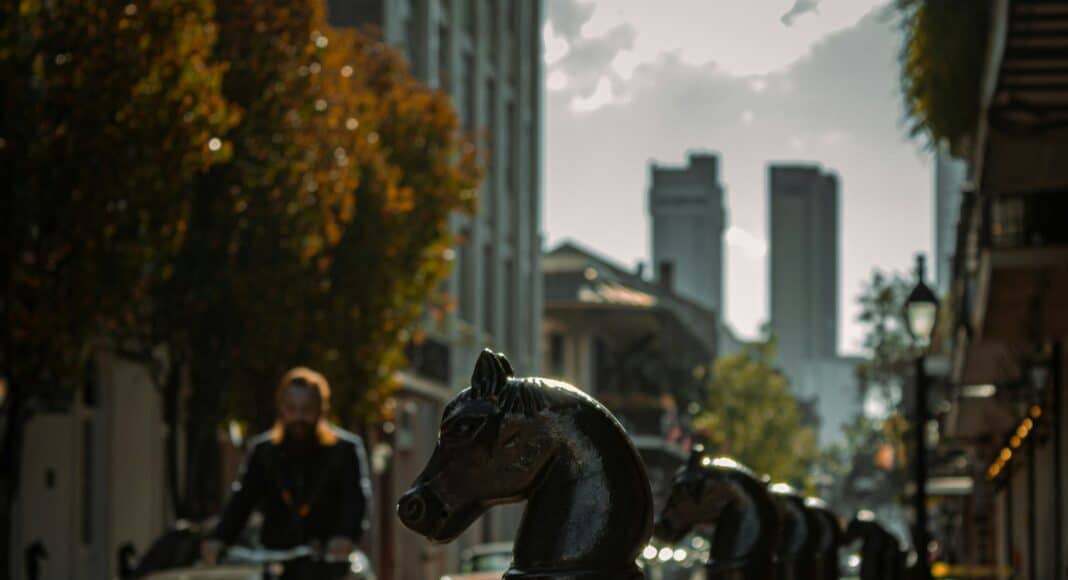 a person riding a bike on a city street