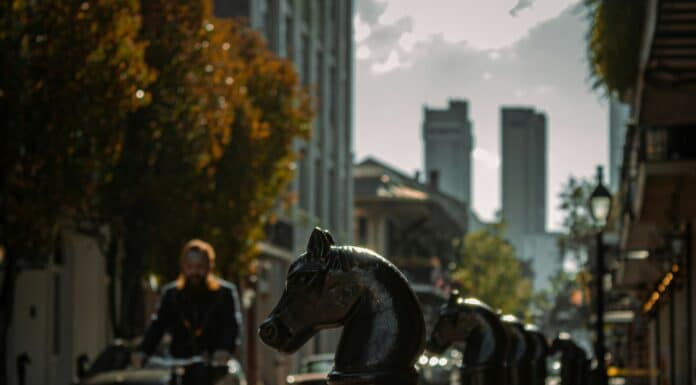 a person riding a bike on a city street
