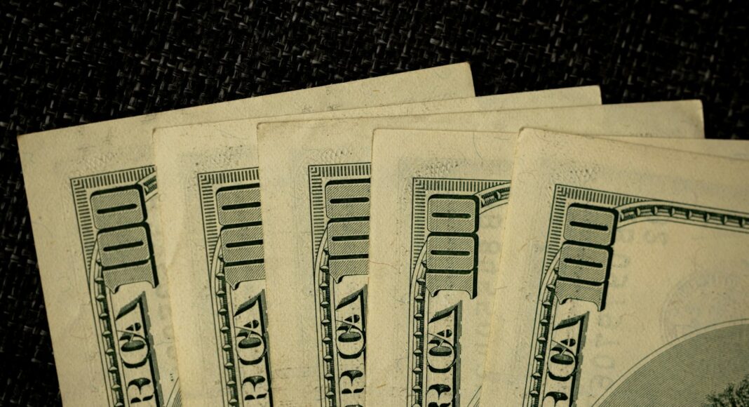 a close up of a bunch of money on a table