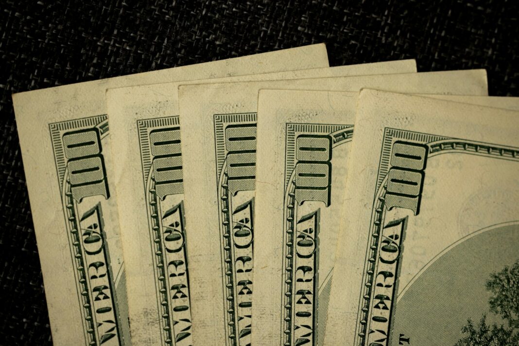 a close up of a bunch of money on a table