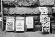 assorted signages in grayscale photography