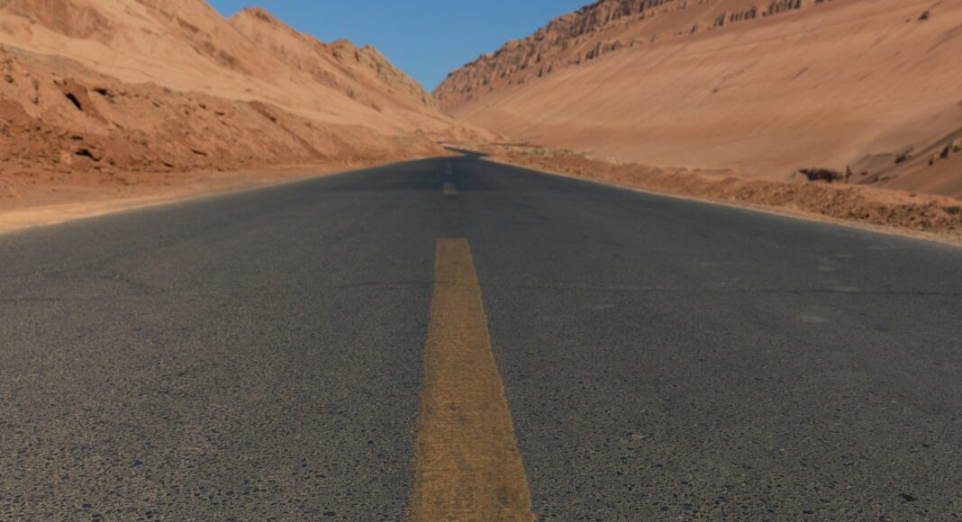brown sand near brown mountain during daytime