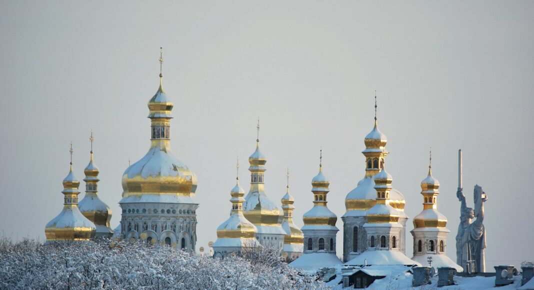 white and gold dome building covered with snow