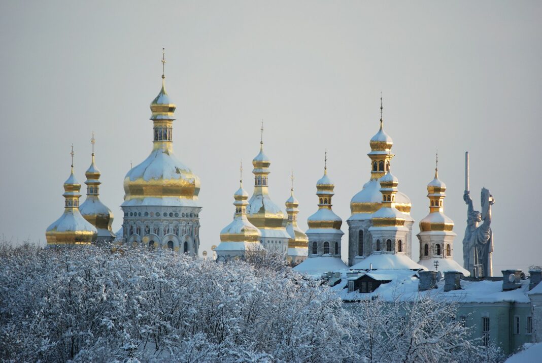 white and gold dome building covered with snow