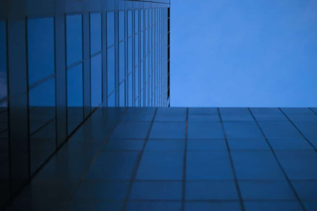 a tall building with a blue sky in the background