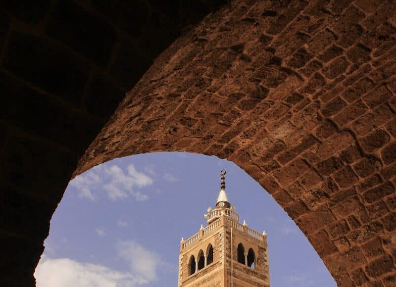 a large brick building with a clock tower