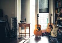 several guitars beside of side table