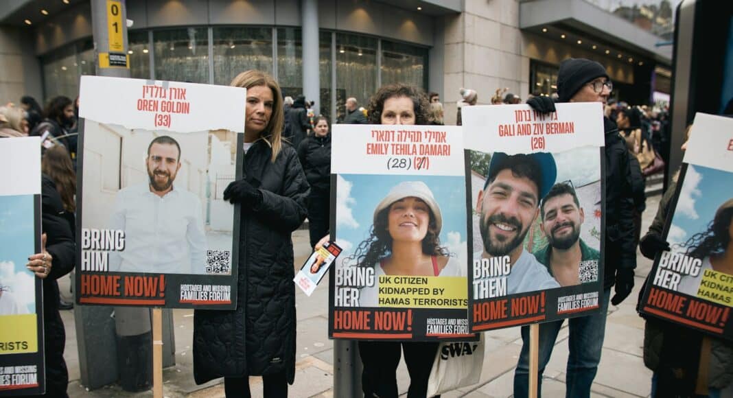 A group of people holding up signs on the street