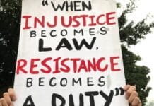 person holding white and black happy birthday greeting card