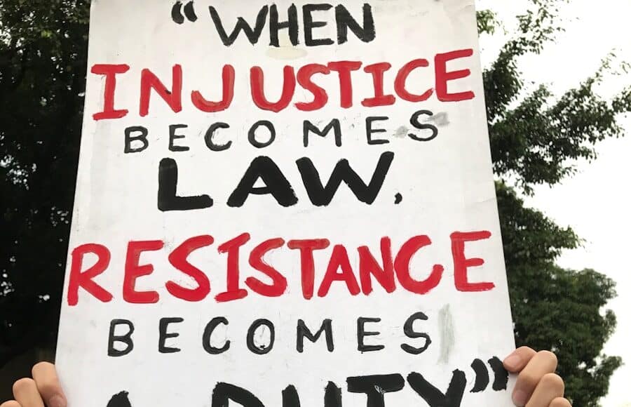 person holding white and black happy birthday greeting card