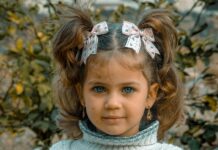 a little girl with a flower crown