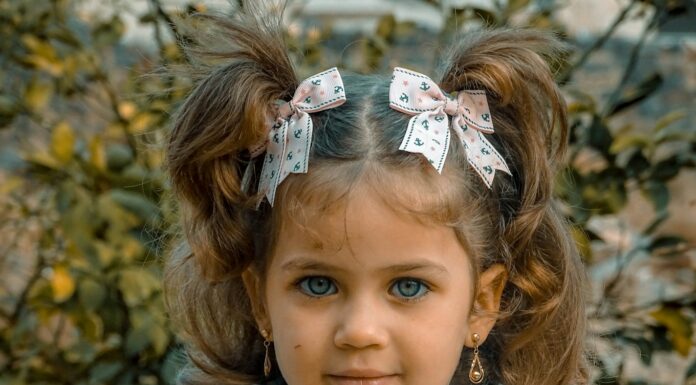 a little girl with a flower crown