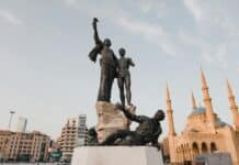 Revue de presse du 25/02/25: La nouvelle ère politique sous Joseph Aoun man in black suit statue