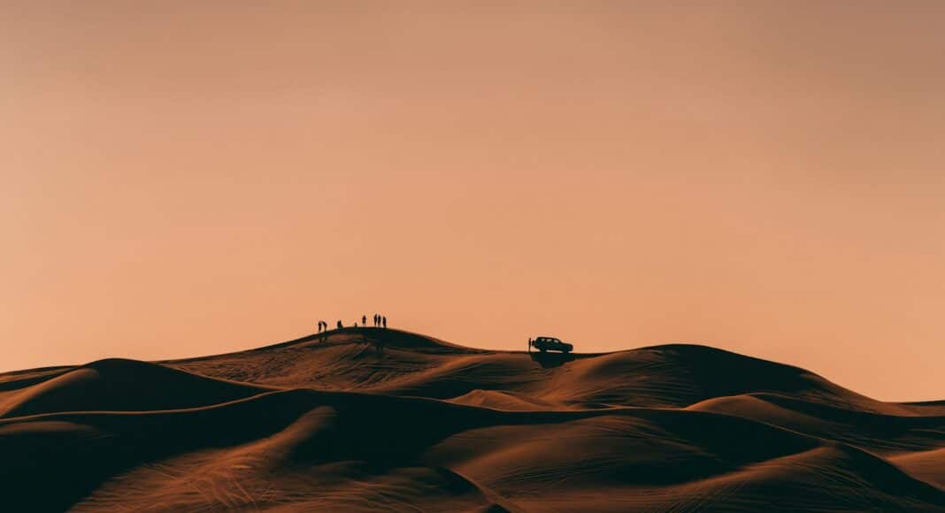 people walking on desert during daytime