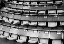 brown wooden chairs on gray concrete floor
