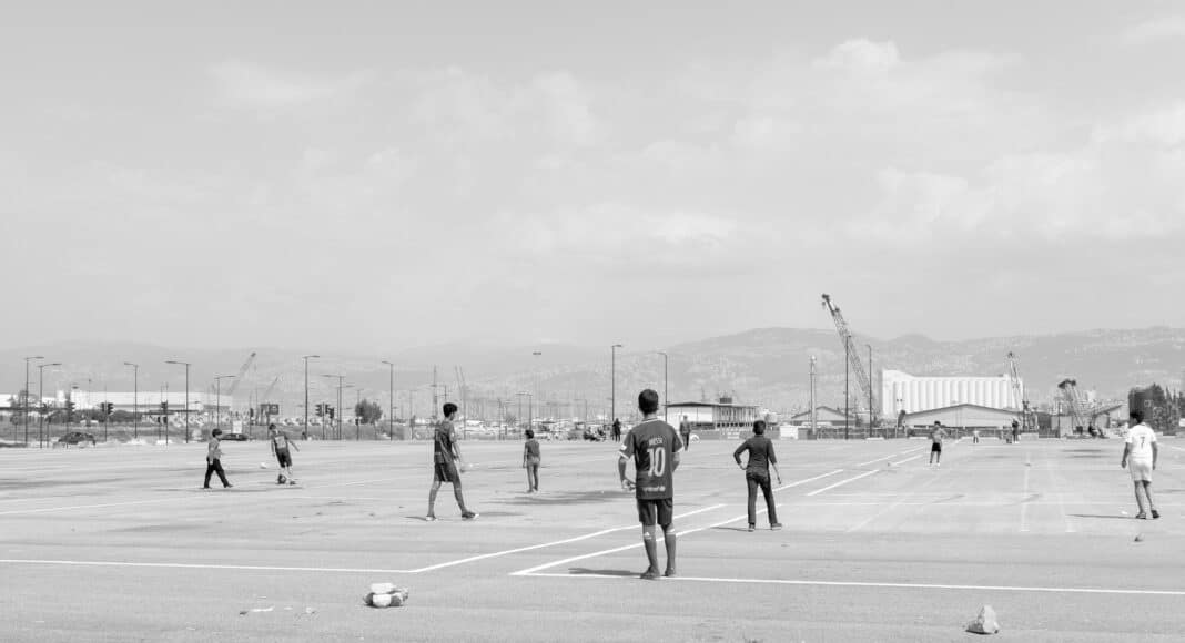 men playing on field photo