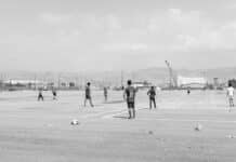 men playing on field photo
