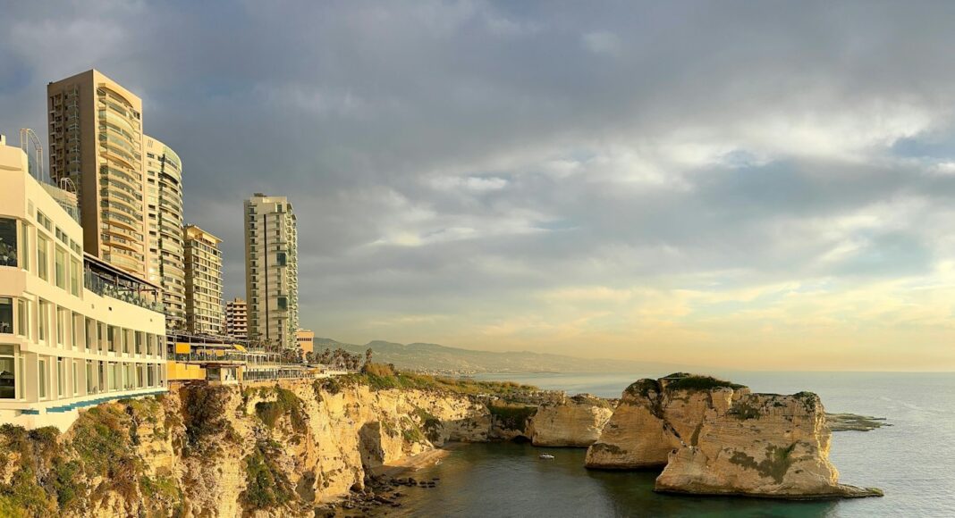 A large body of water next to a cliff