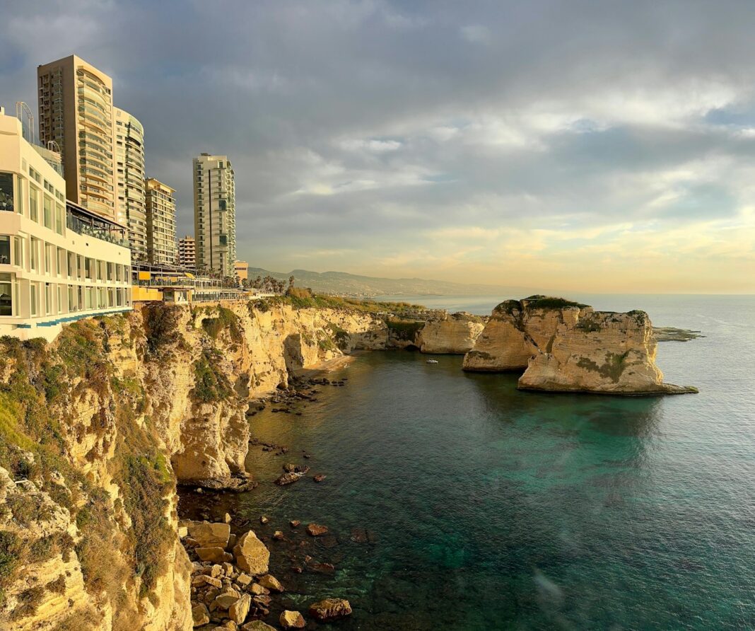 A large body of water next to a cliff