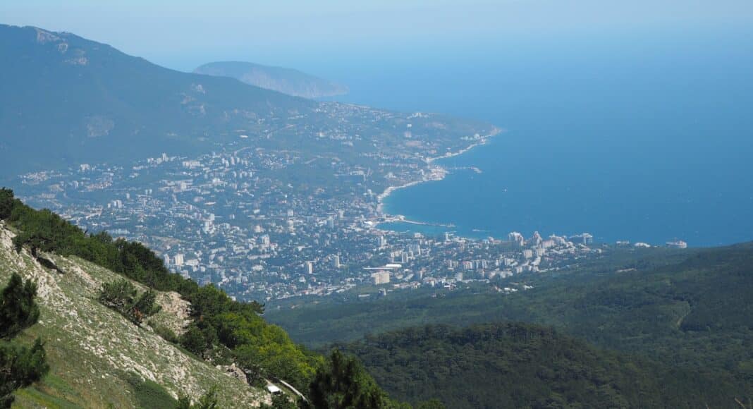 a view of a city from a mountain top