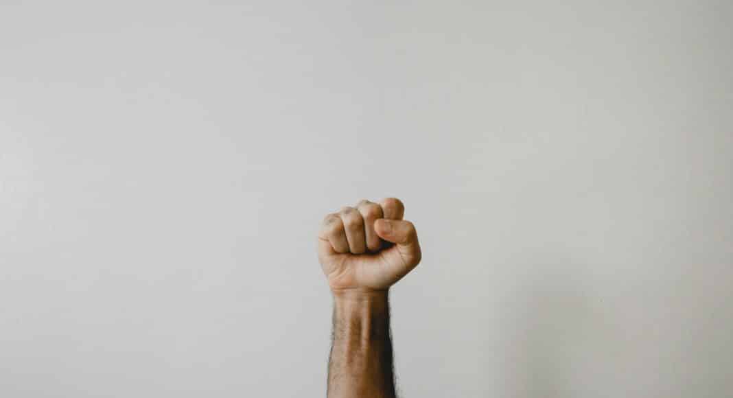 persons right foot on white wall