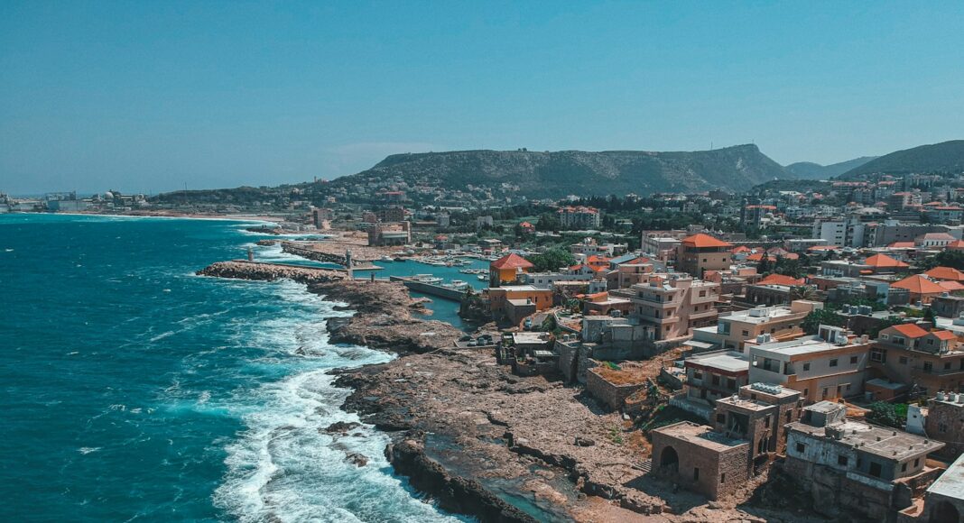 aerial view of city near body of water during daytime