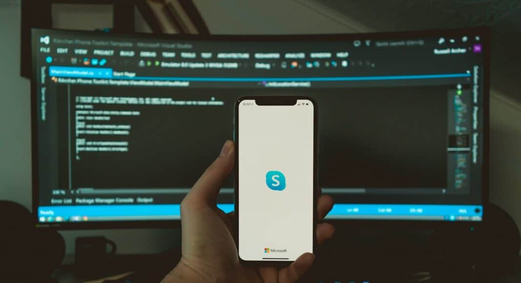 person holding white iphone 5 c