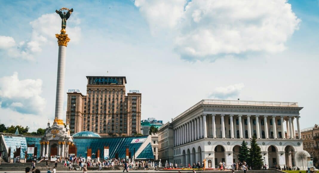people walking near white concrete building