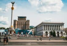 people walking near white concrete building