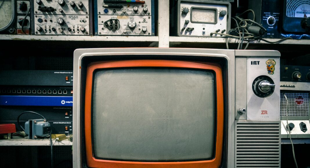grey and orange CRT TV