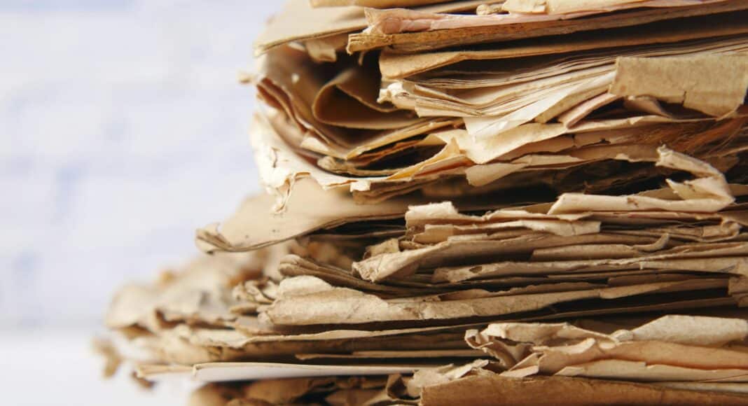 a close up of a pile of paper on a table