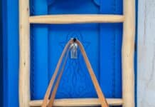 brown leather tote bag hanging on wall