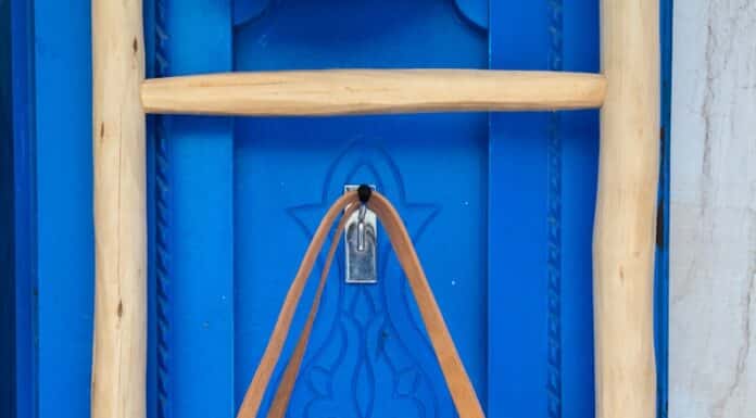 brown leather tote bag hanging on wall