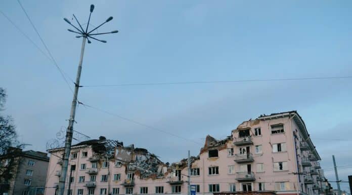 a building that has been torn down and is next to a street light