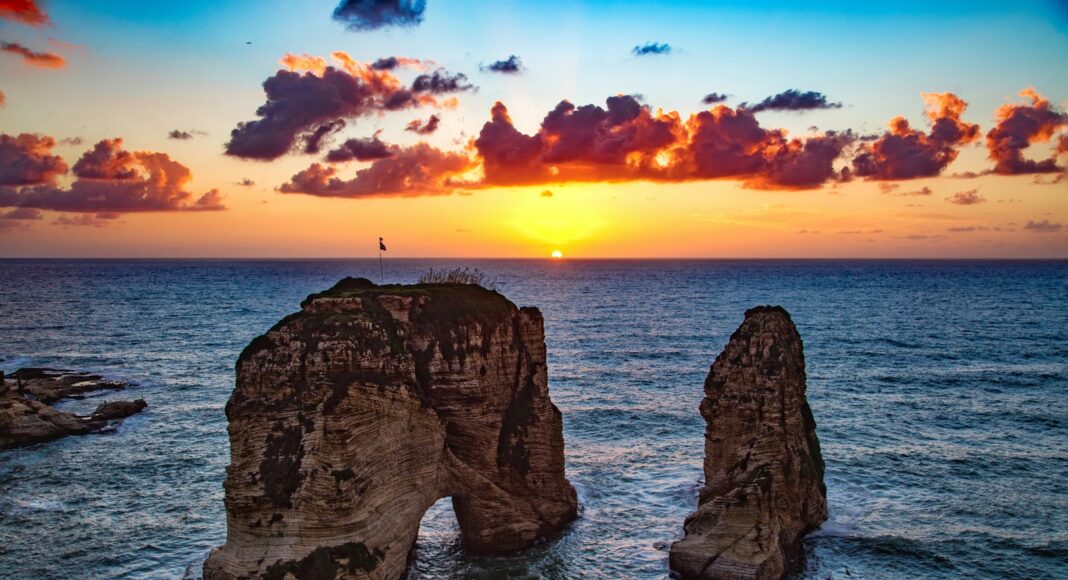 two rock formations in body of water