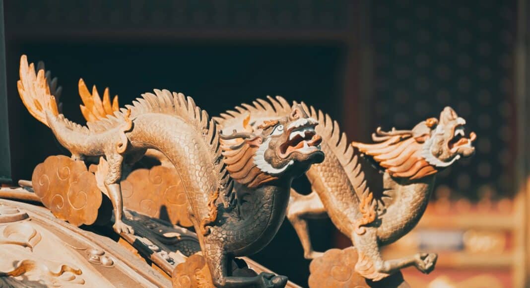 gold dragon figurine on black table