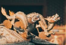 gold dragon figurine on black table