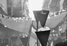 a group of people walking down a street