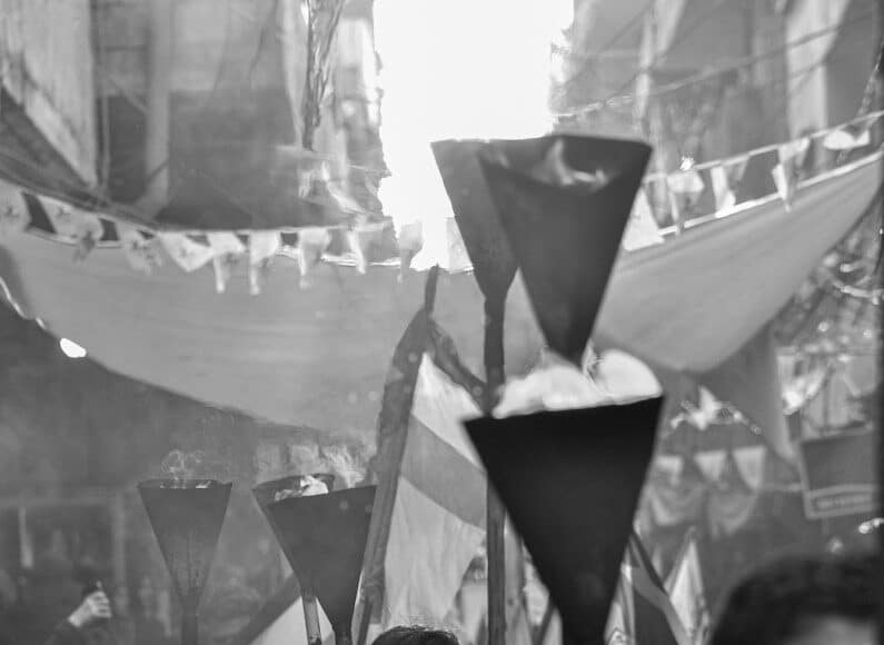 a group of people walking down a street