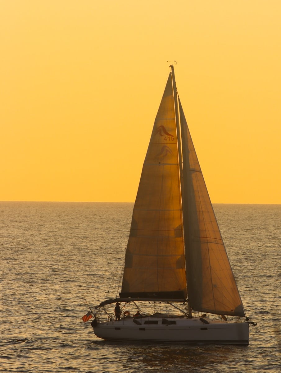 a sailboat in the middle of a body of water