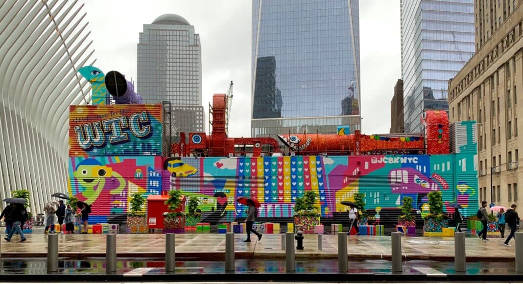 people walking on street near high rise buildings during daytime