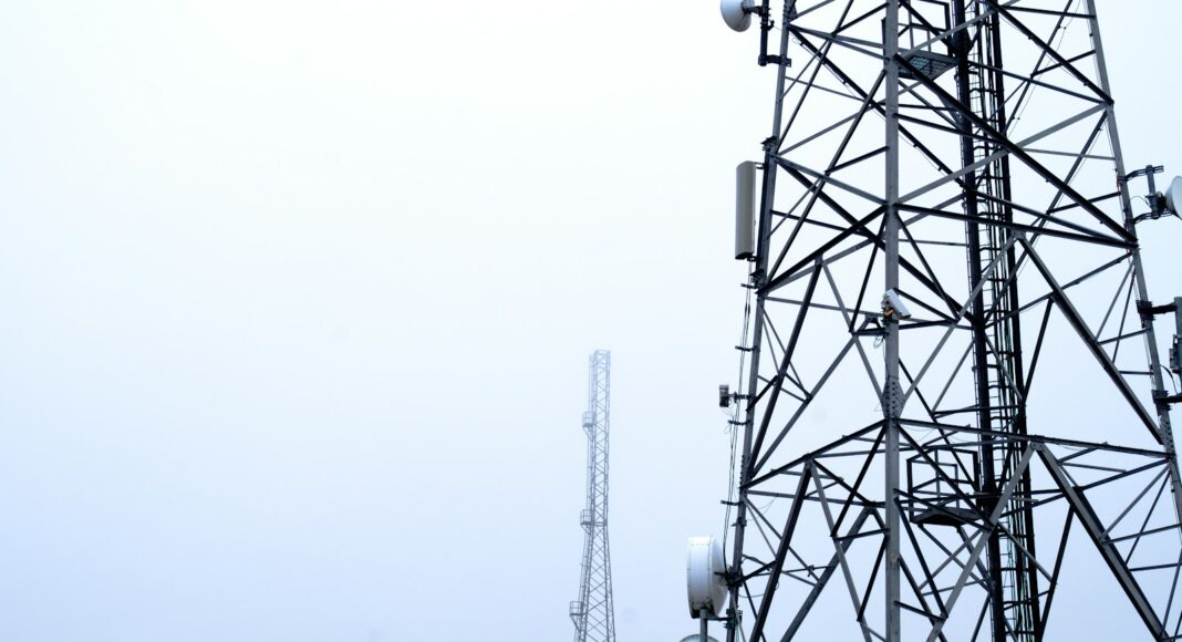a tower with several cell phones on top of it