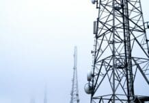 a tower with several cell phones on top of it