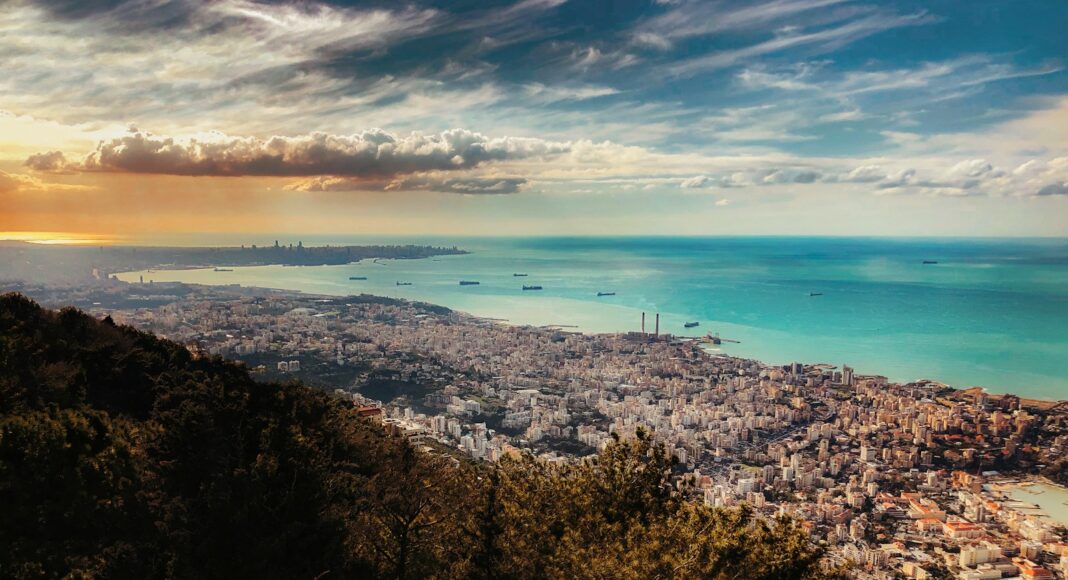 aerial photography of mountain and sea during daytime