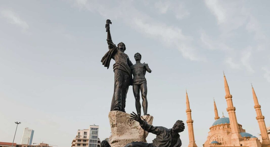 man in black suit statue