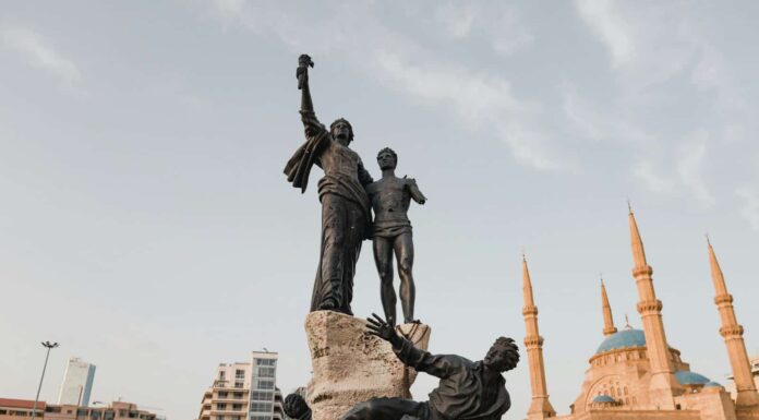 man in black suit statue