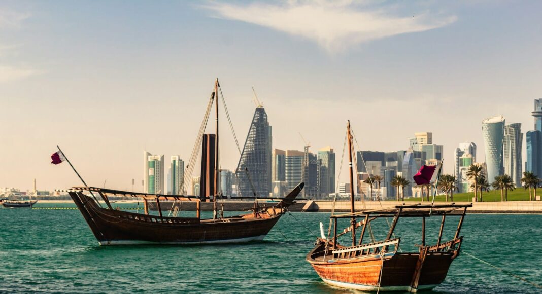 two ships on body of water near the city