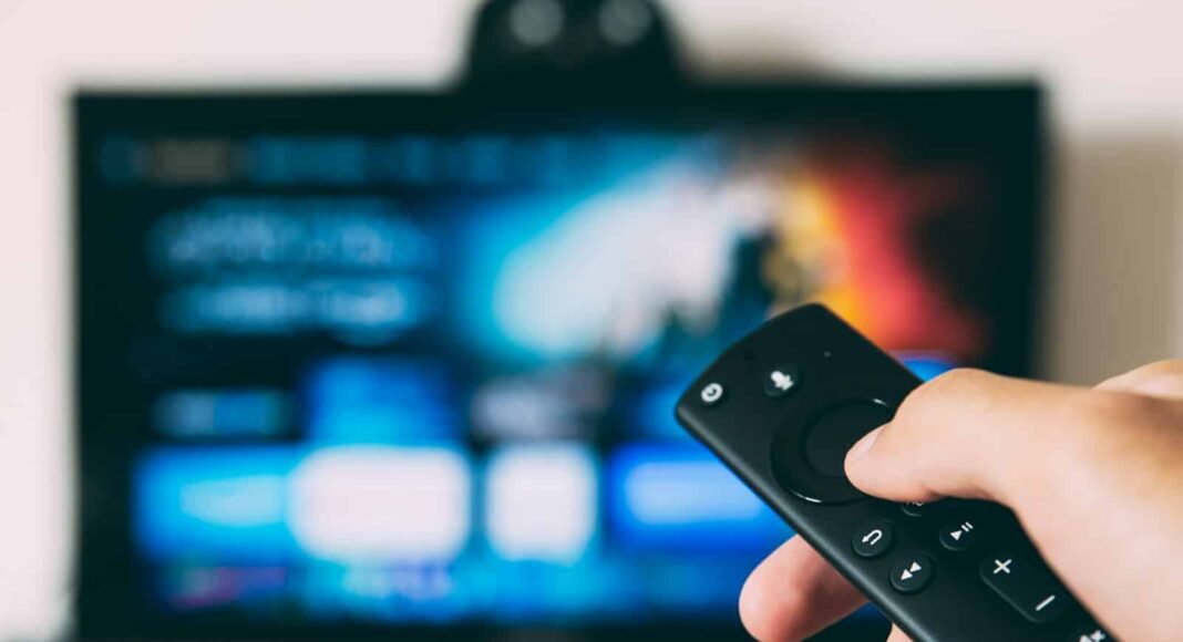 turned-on flat screen television